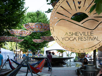 Special Event: WND Asheville Umbrellas Crown Pack Square at Asheville Yoga Festival.