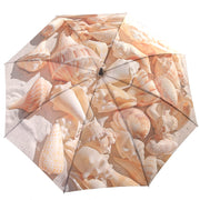 Conch Seaside Fan Umbrella outside Wendy Newman Designs